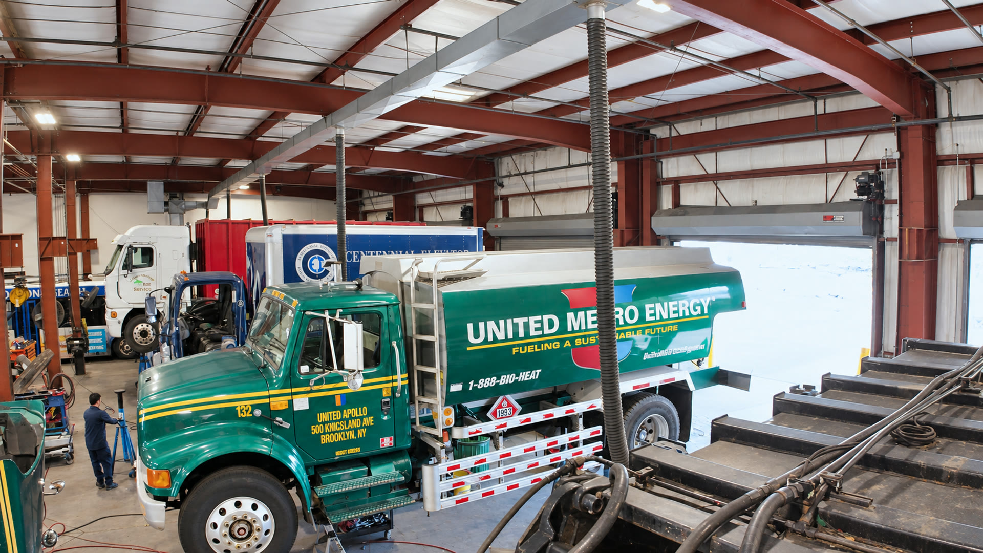 Green tanker truck in the shop